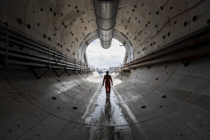 A person walking through a tunnel