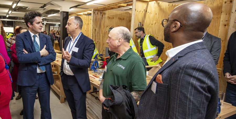 HS2 Minister, Huw Merriman MP talks to HS2 Euston Area Director, Andy Swift alongside Steve Boyle - a local Camden resident who works on the HS2 project after hearing about opportunities from the Camden skills fair.