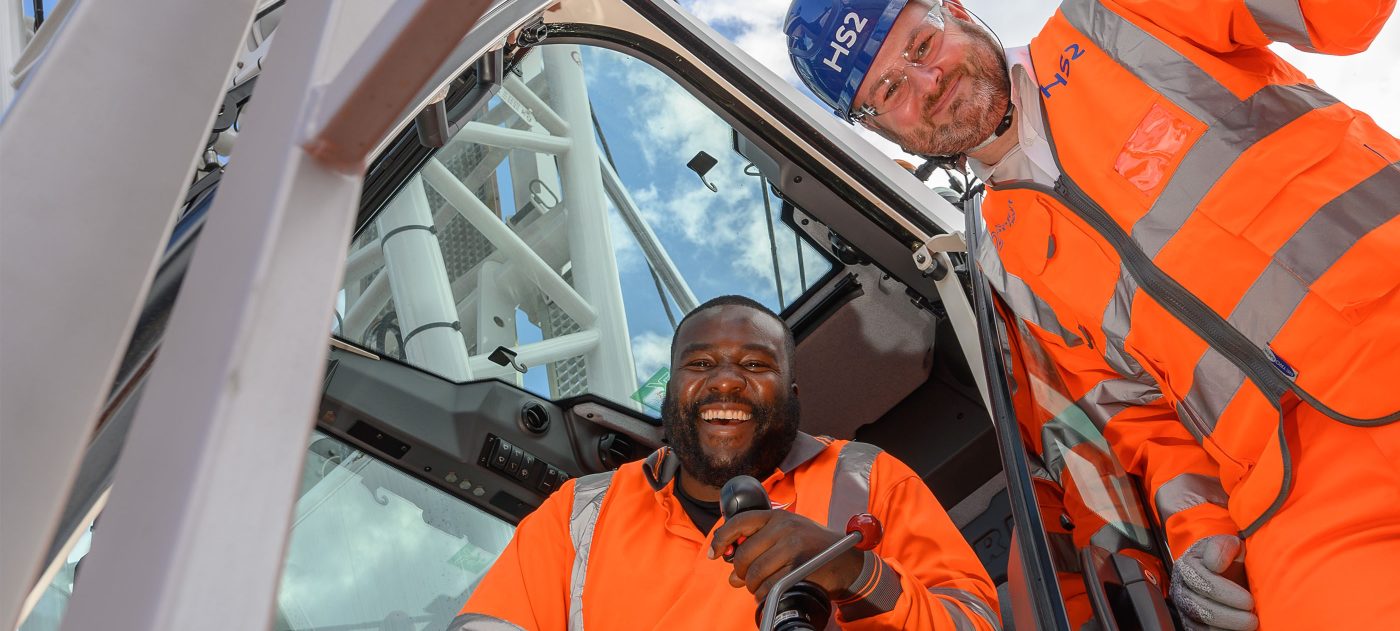 Two people in a crane.