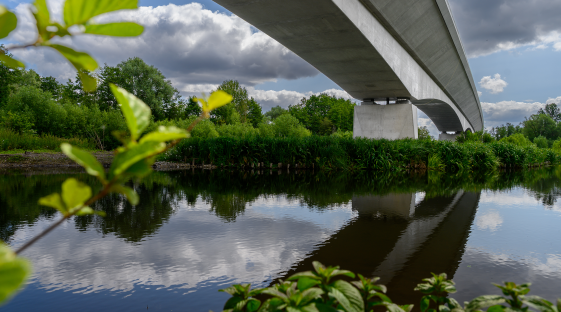Ground-level view of the Colne Valley viaduct crossing one of the lakes.