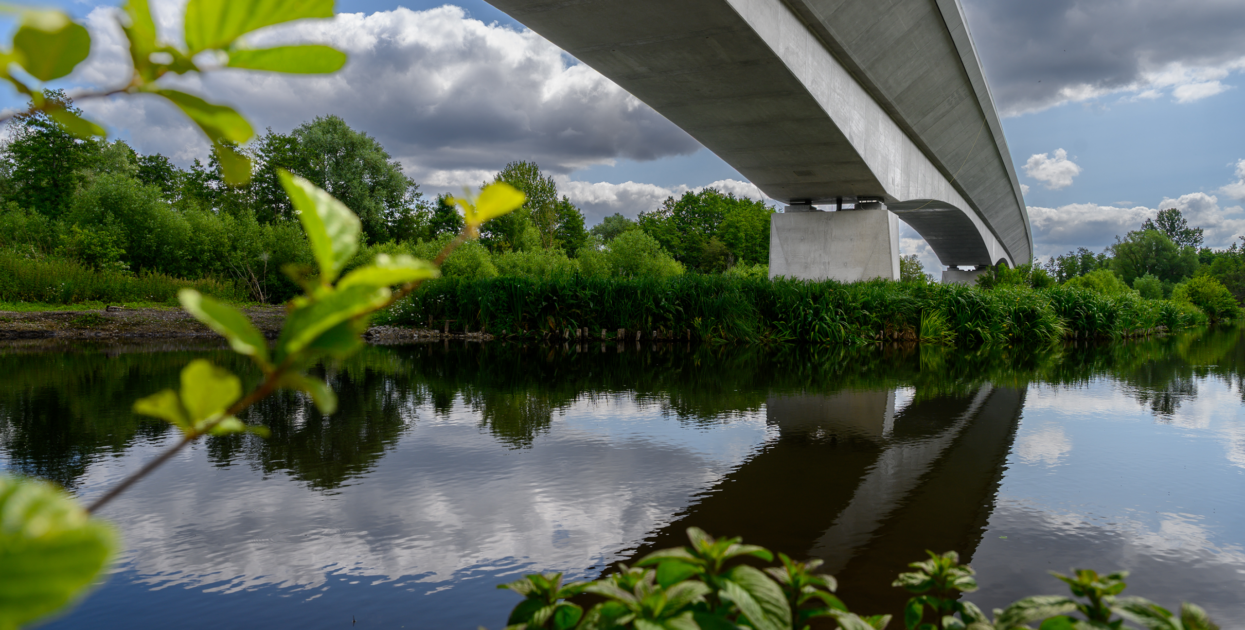 Ground-level view of the Colne Valley viaduct crossing one of the lakes.