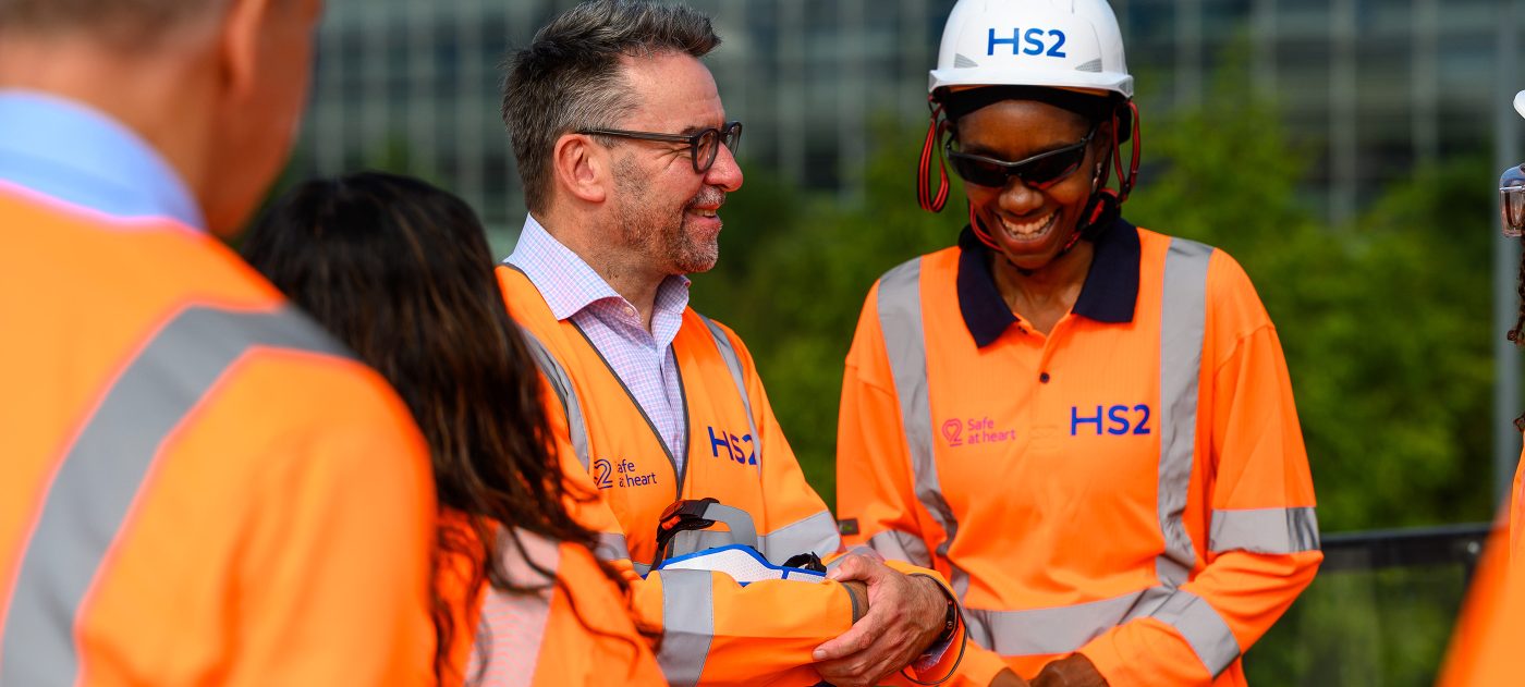 HS2 CEO Mark Wild chatting with an apprentice in Birmingham.