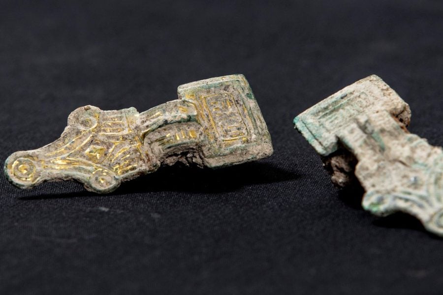 A set of copper alloy small square headed brooches, decorated with gold gilt, from the 5th or 6th century, uncovered during the archaeological work in Wendover.