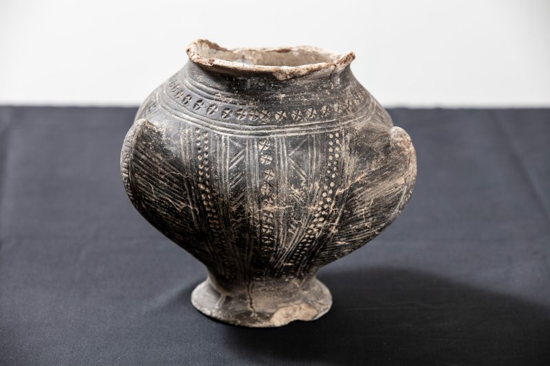 A 6th century decorative footed pedestral bückelurn with three horns, decorated with cross stamps, found in an Anglo Saxon grave during excavations.