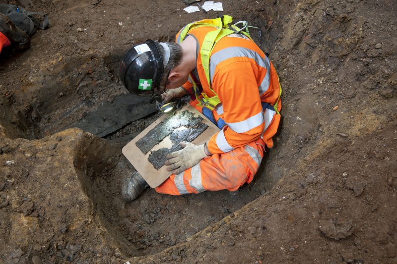 An archaeologist examines a coffin plate at St James’s.