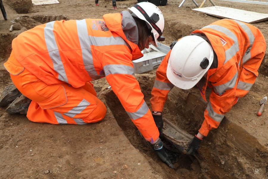 Removing the breast plate of Captain Matthew Flinders.